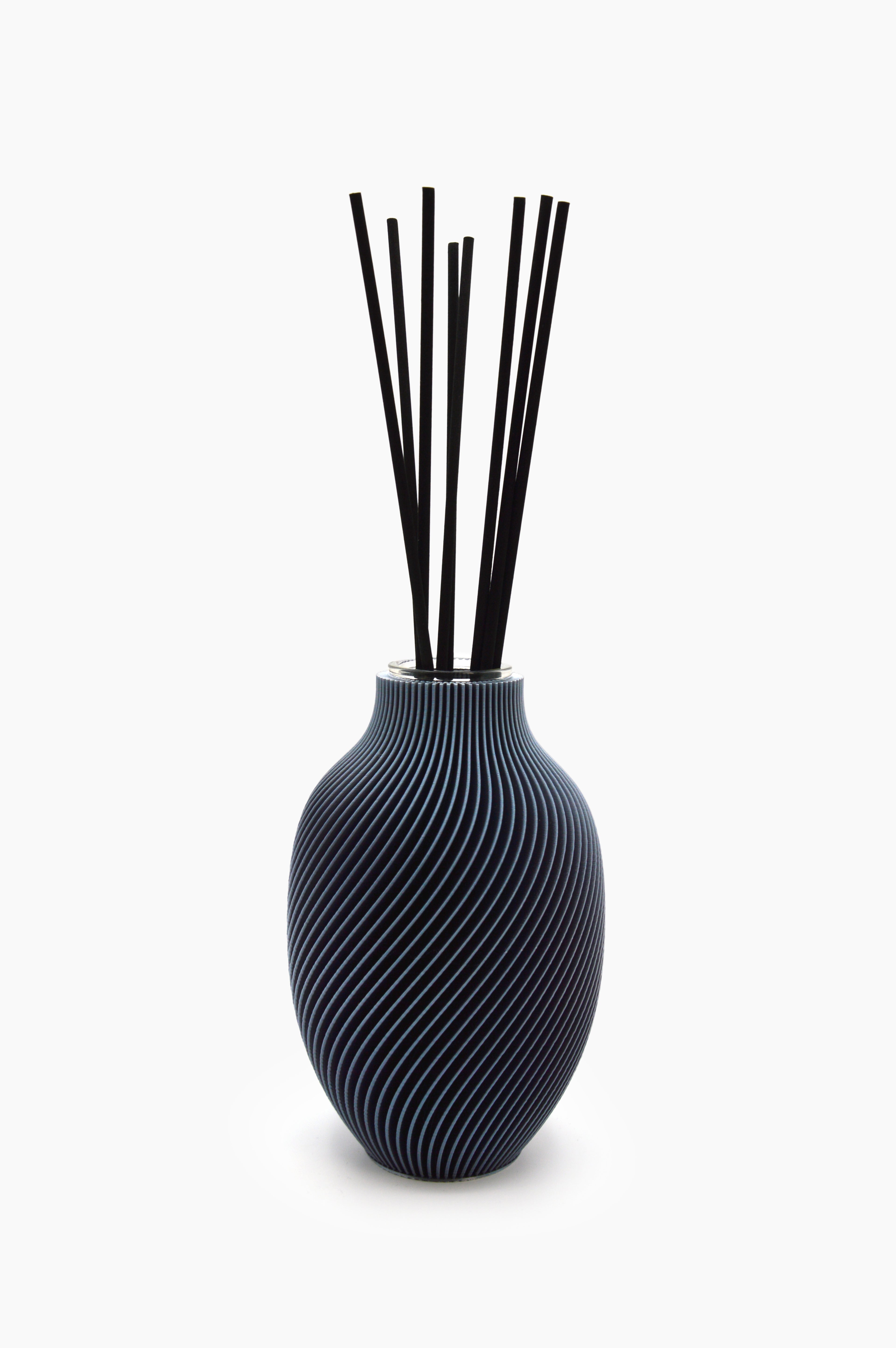 Diffusore Eolia · grigio grafite · design 3D spirale · ricaricabile · Made in Italy · Yliaca